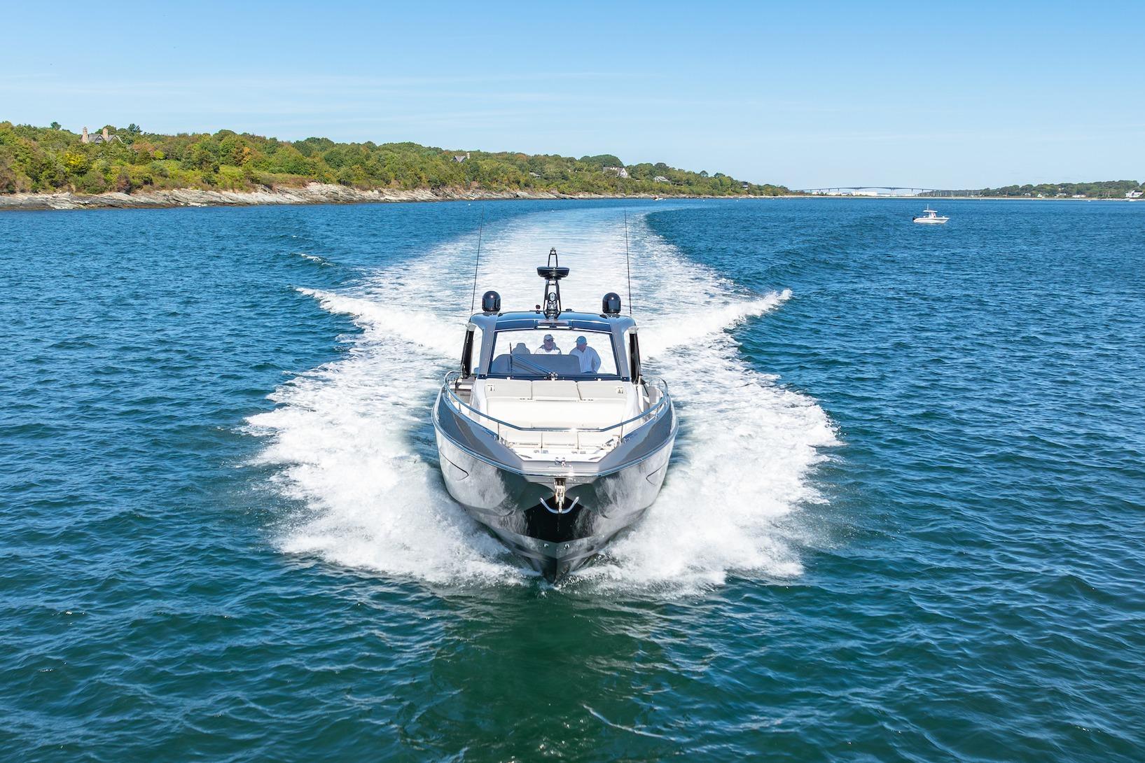 2023 Azimut Verve 47 yacht cruising on open water, surrounded by scenic coastline.