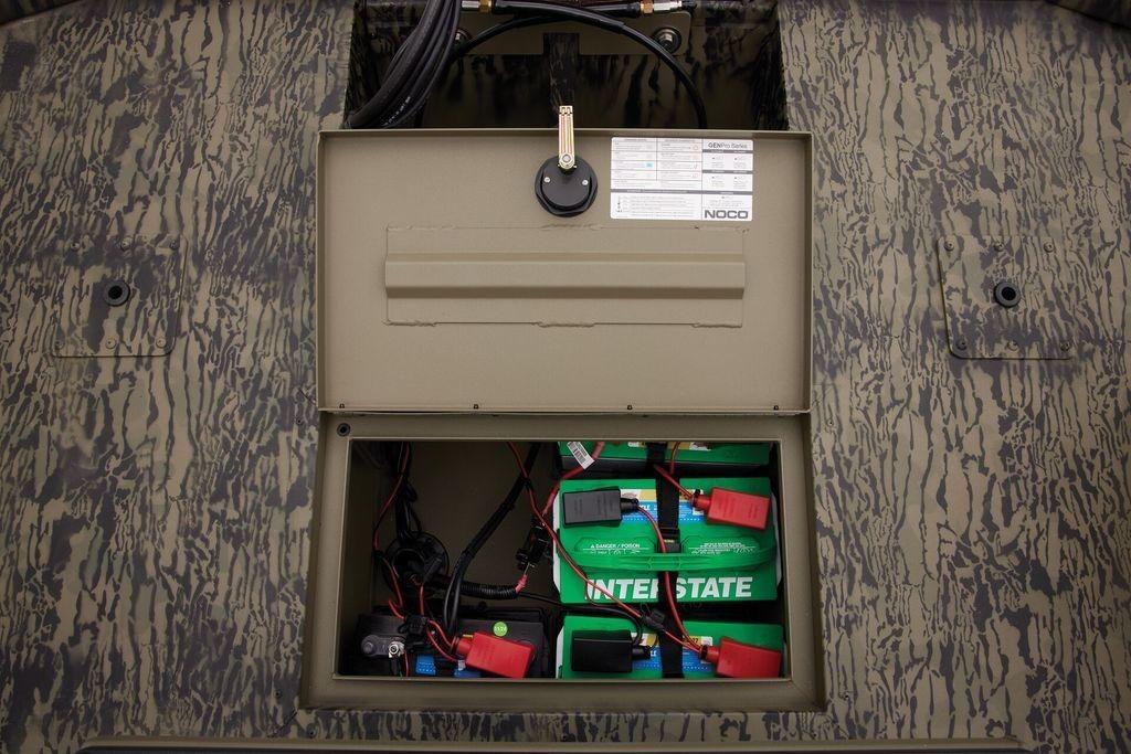 Battery compartment of 2026 Tracker GRIZZLY® 2072 CC Sportsman boat, featuring Interstate batteries.