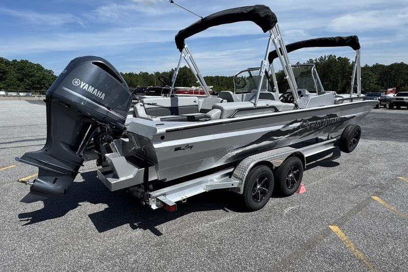 2025 SeaArk Super Lounge Easy boat with Yamaha engine on trailer.