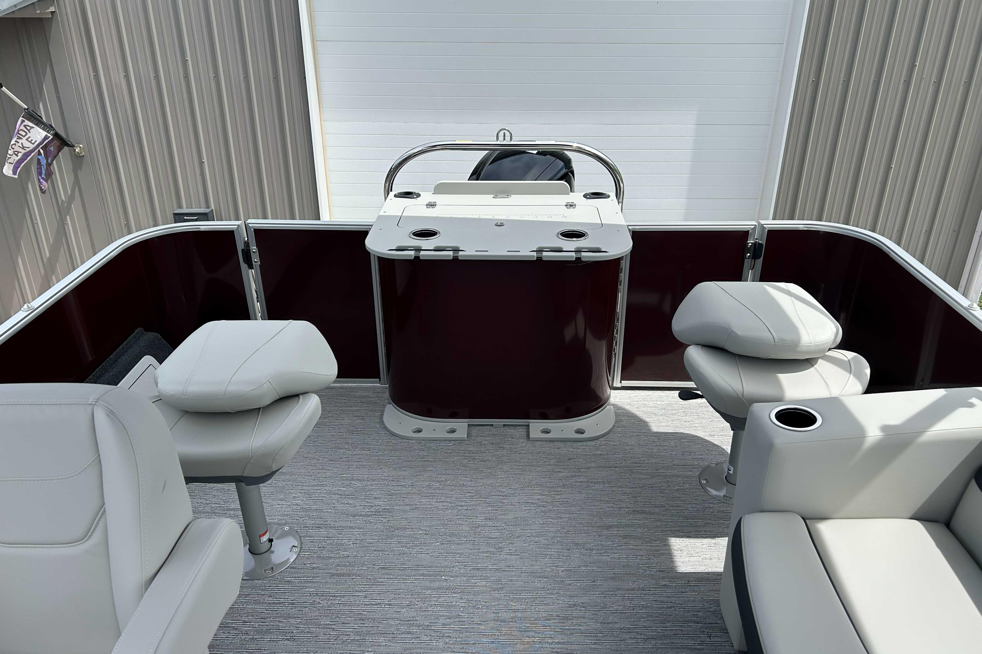 2026 Starcraft EX 20 F pontoon boat interior with seating and helm station.