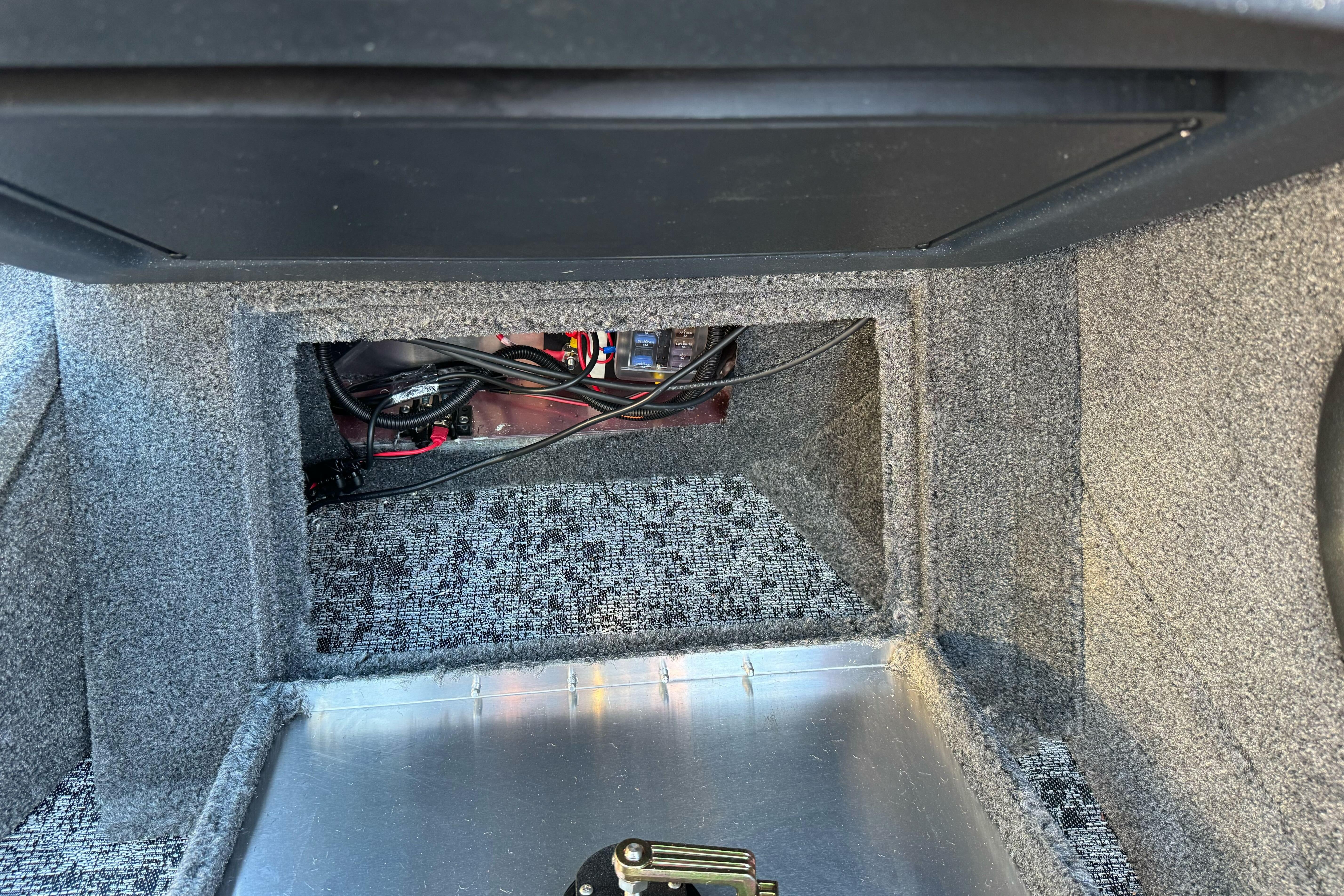 Interior view of 2026 Tracker Targa V-18 WT boat compartment with wiring.