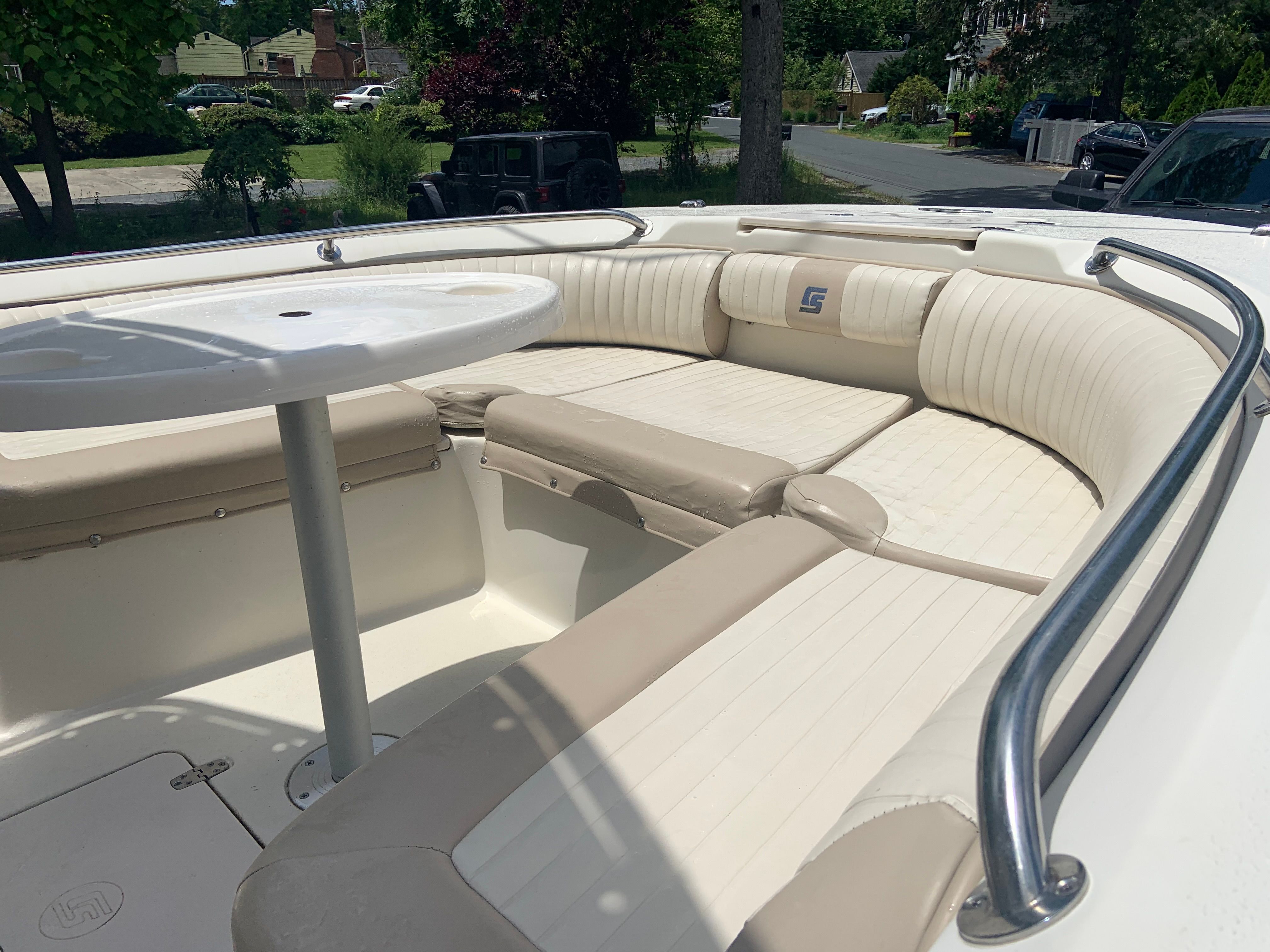 2014 Carolina Skiff 23 Ultra Elite with seating area and table.