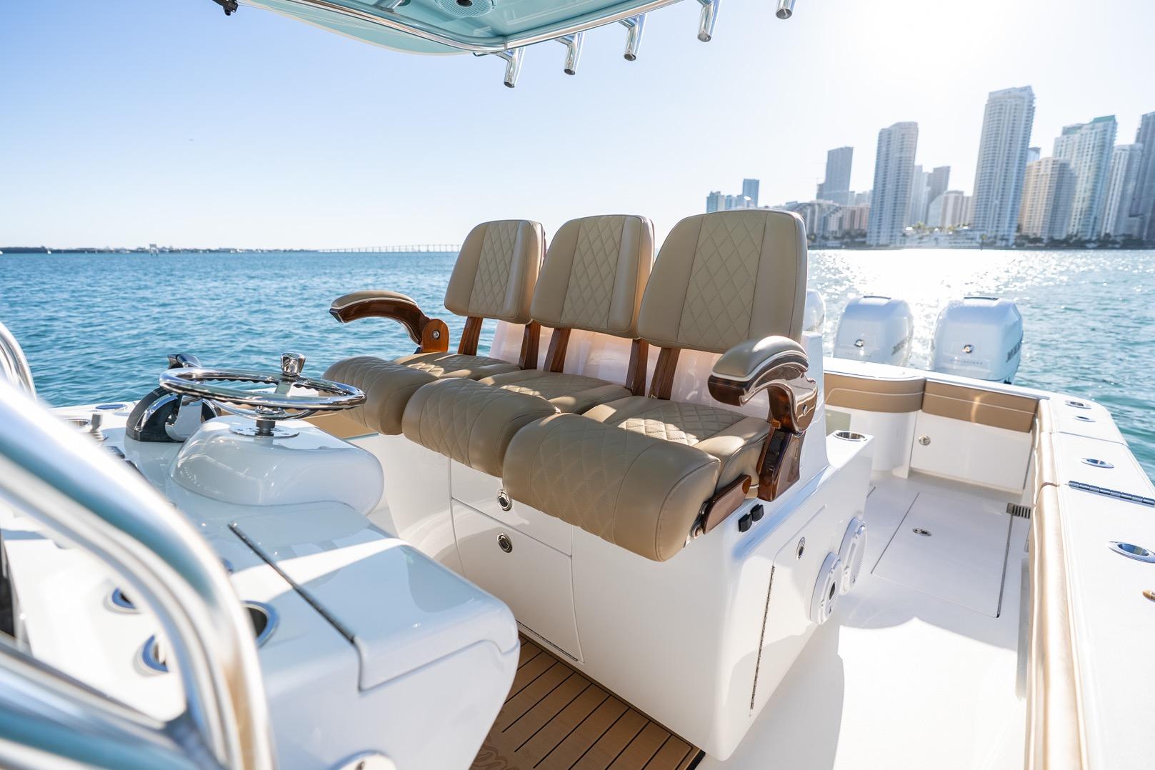 2022 Valhalla Boatworks V-37 interior with luxurious seating, ocean view, and city skyline.