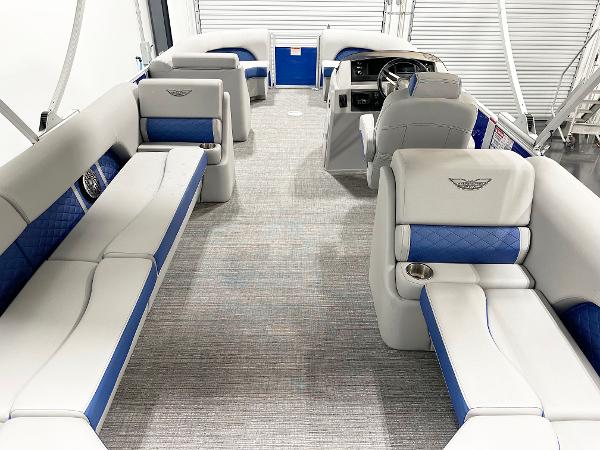 2025 Bennington 23LFBCSR pontoon boat interior with blue and white seating, modern design.