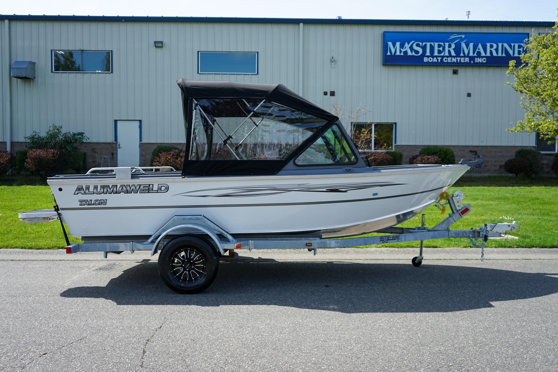 2026 Alumaweld Talon 18 boat on trailer outside Master Marine Boat Center.