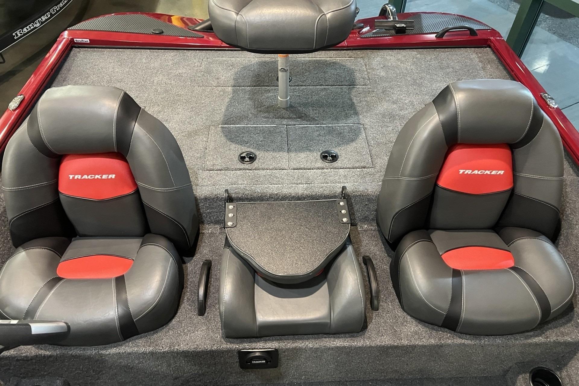 2025 Tracker Savage 215 boat interior with gray and red cushioned seats.