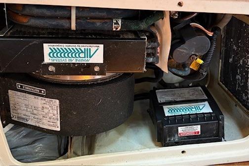 1992 Catalina 34 engine compartment with marine air systems and components.