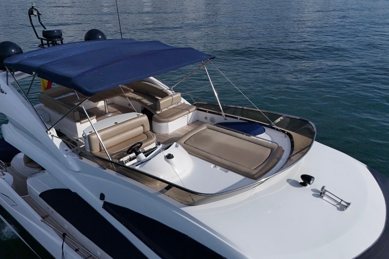 2007 Sunseeker Manhattan 66 yacht with spacious deck and seating area on calm water.