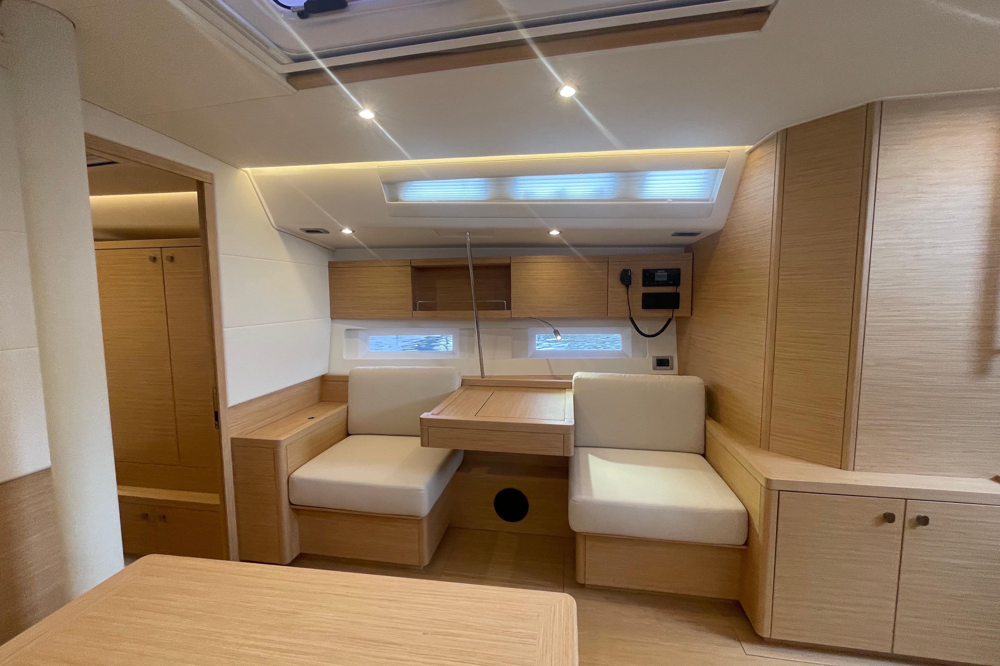 Luxurious interior of 2026 Grand Soleil 42 Long Cruise yacht with modern wood finish.