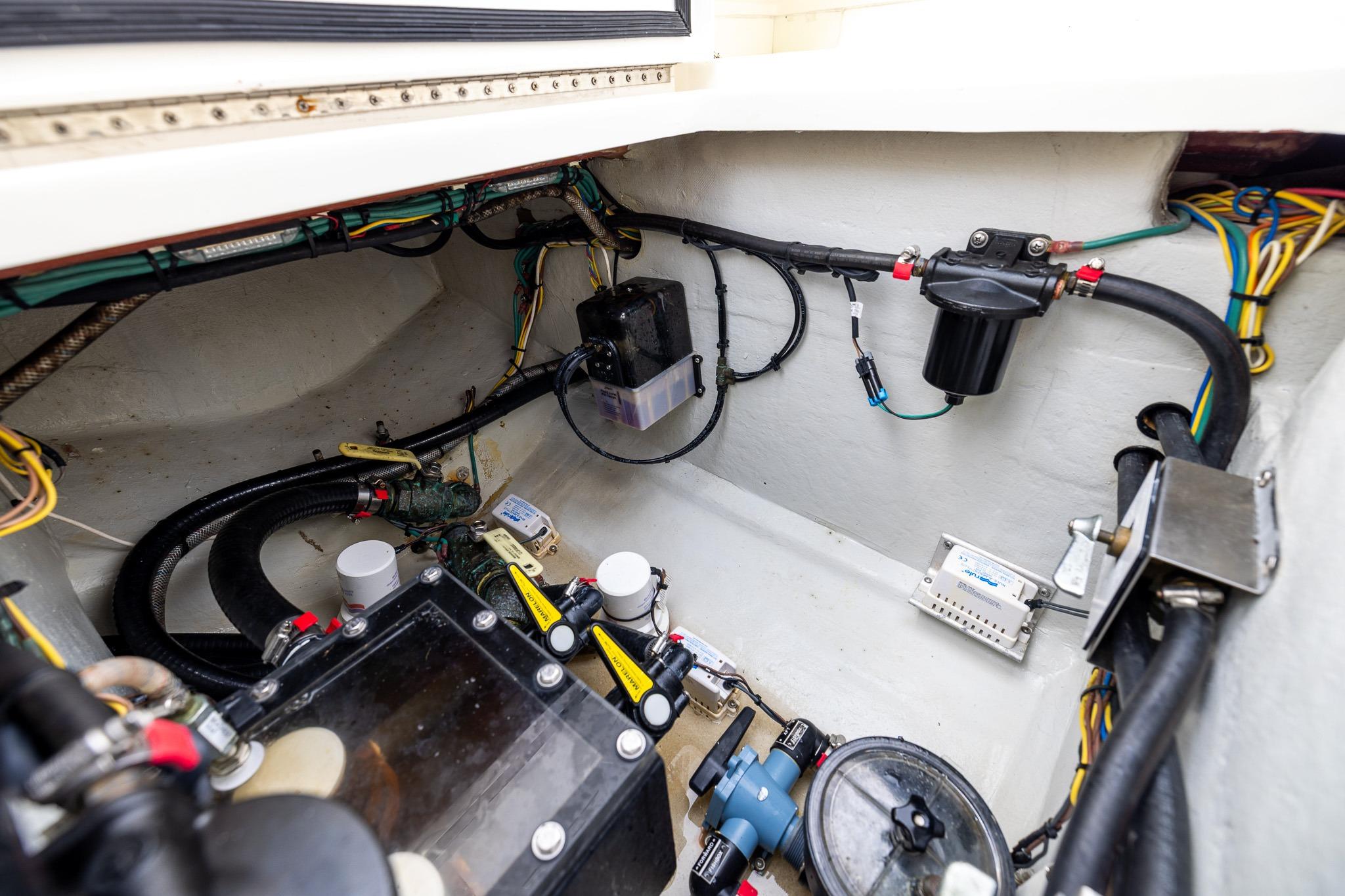 Engine compartment of a 2019 SeaVee 322Z boat, showcasing wiring and components.