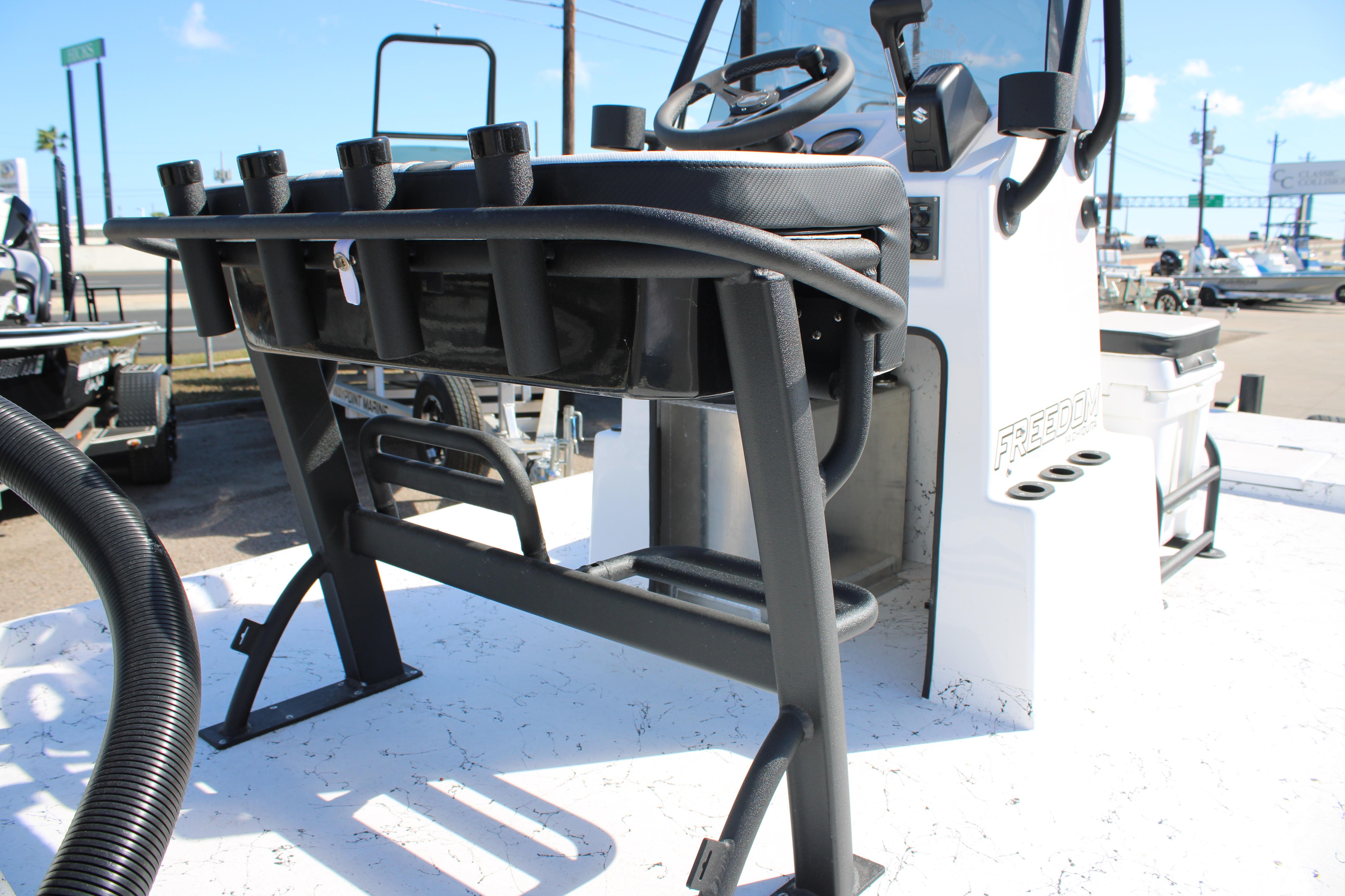 2026 Freedom Boats Chiquita console with rod holders and steering wheel.