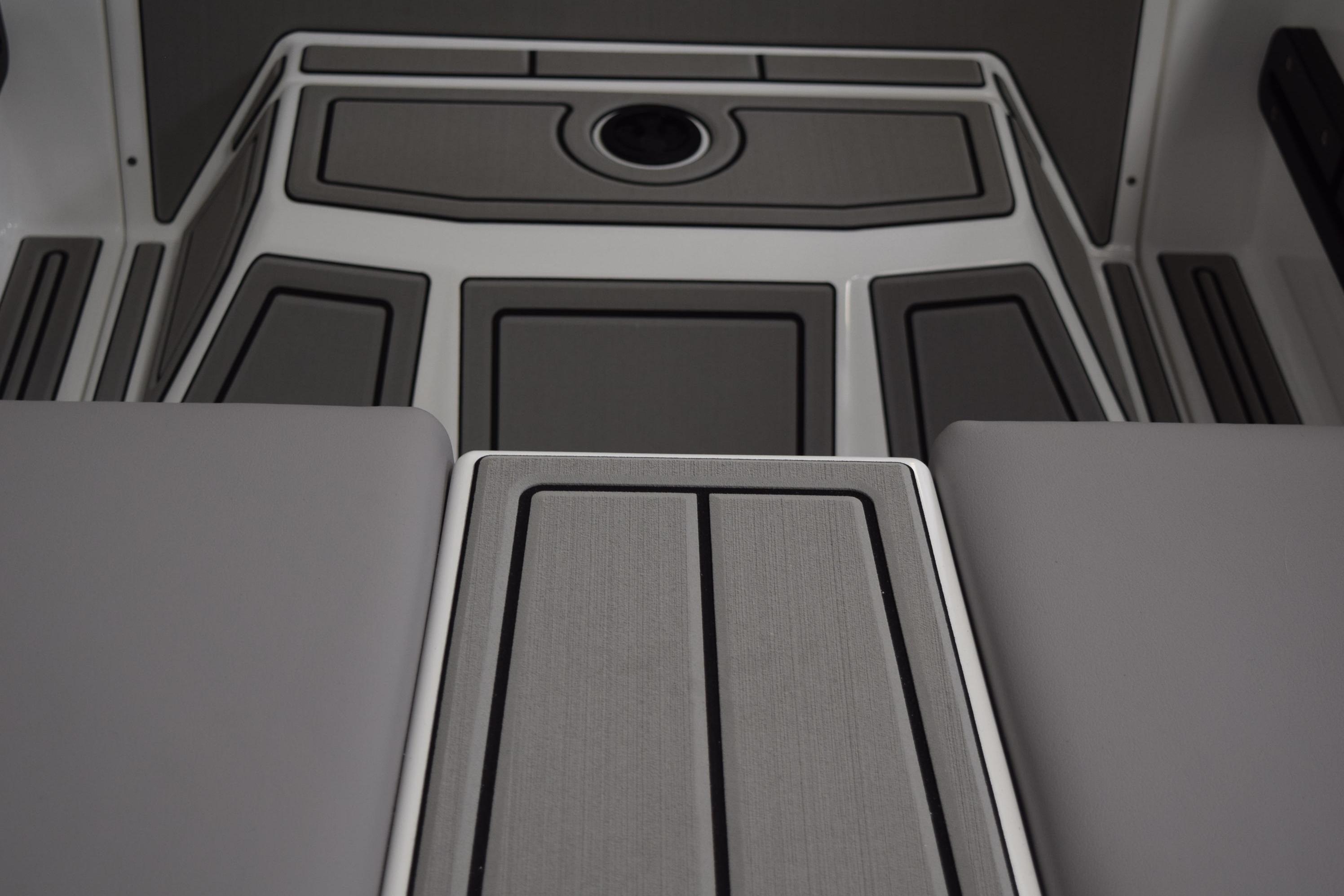 2026 Moomba Craz boat interior with sleek, modern gray flooring design.