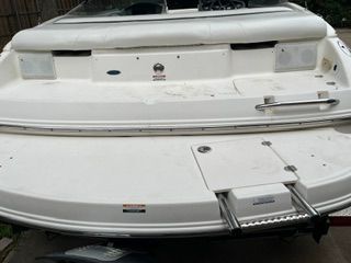 The image shows the stern of a white 2004 Chaparral 190 SSi boat with a swim platform.
