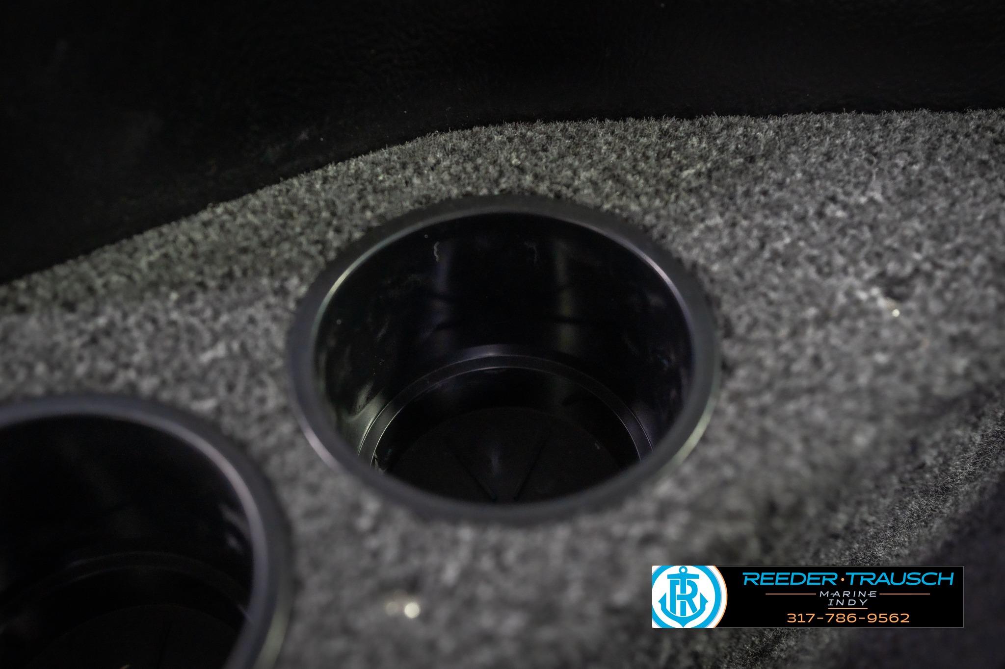 Cup holder in 2026 Lund 2075 Impact XS boat with carpeted surface.