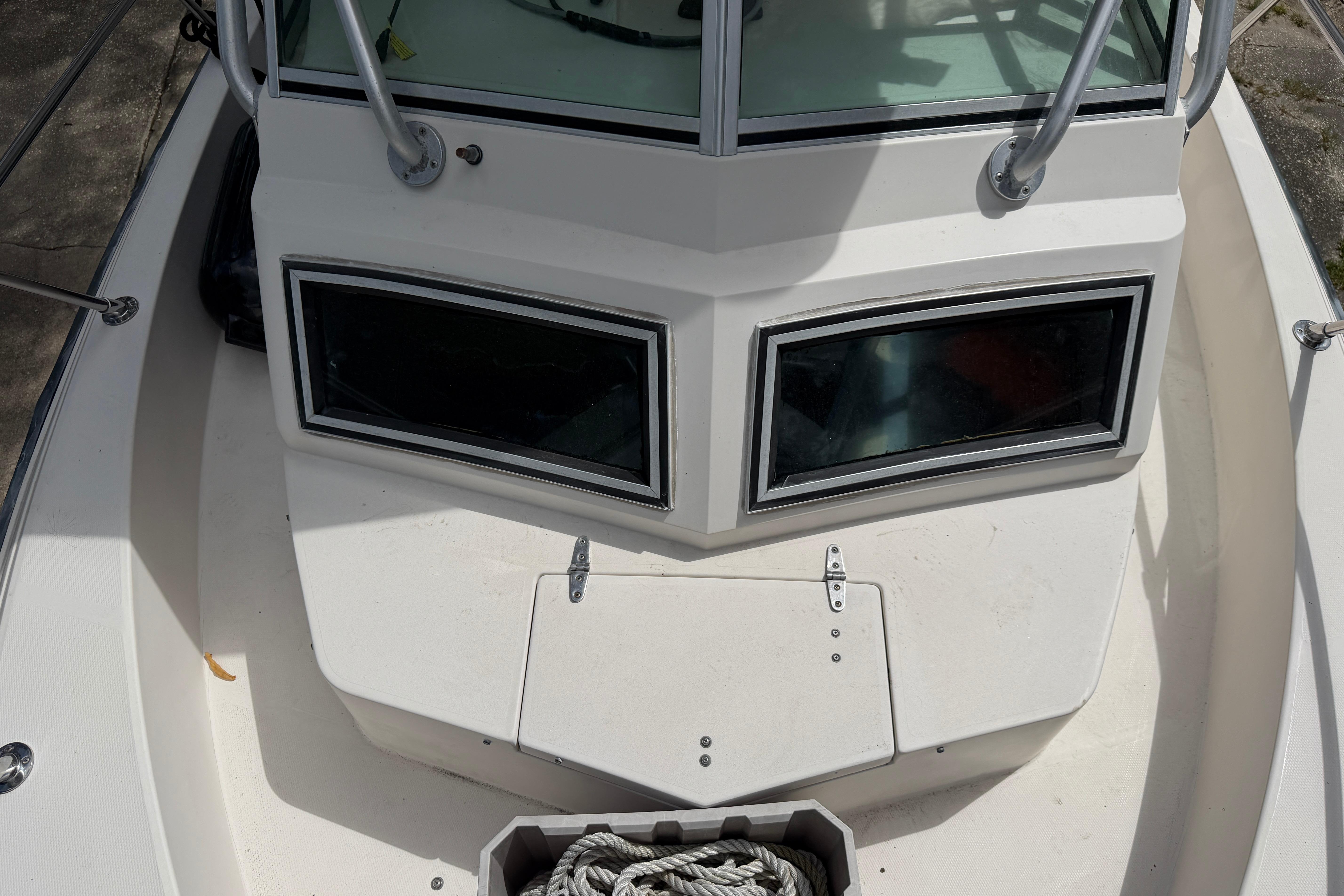 1987 Grady-White Seafarer 226 boat deck with windows and railing.