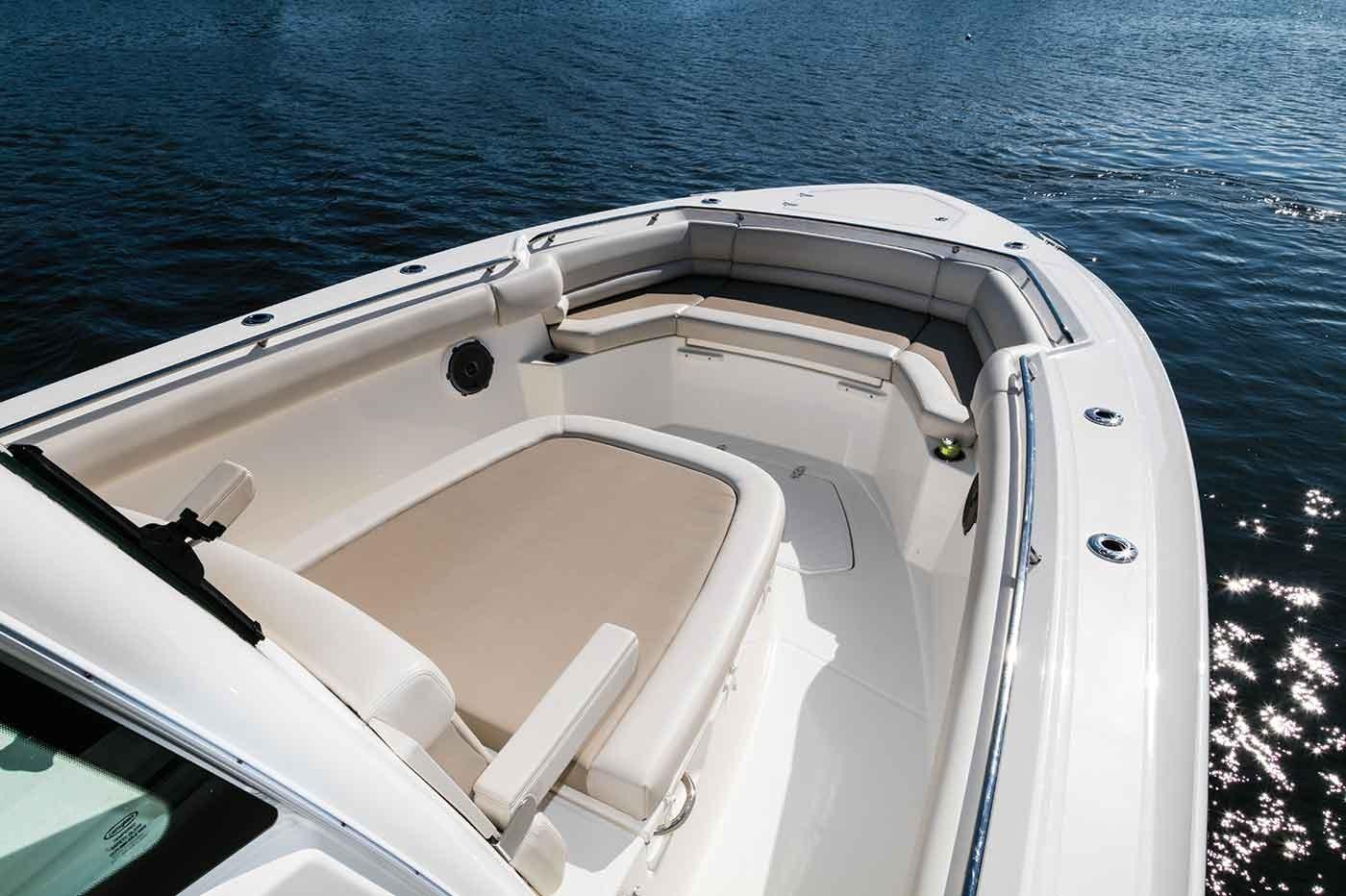 Manufacturer Provided Image: 2019 Boston Whaler 330 Outrage boat with spacious seating area on calm water.