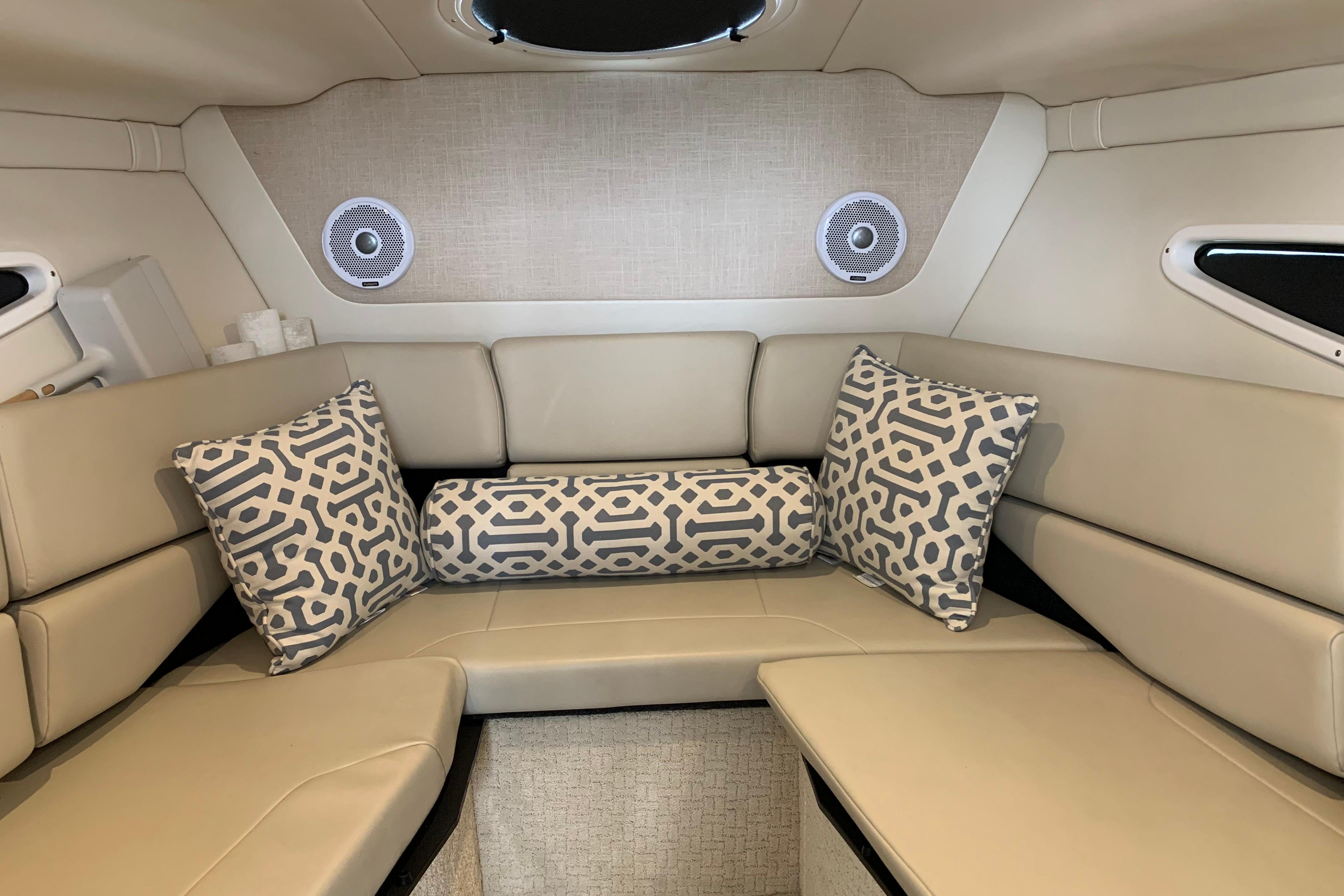 Luxurious interior of 2017 Regal 26 Express boat with patterned cushions and modern design.