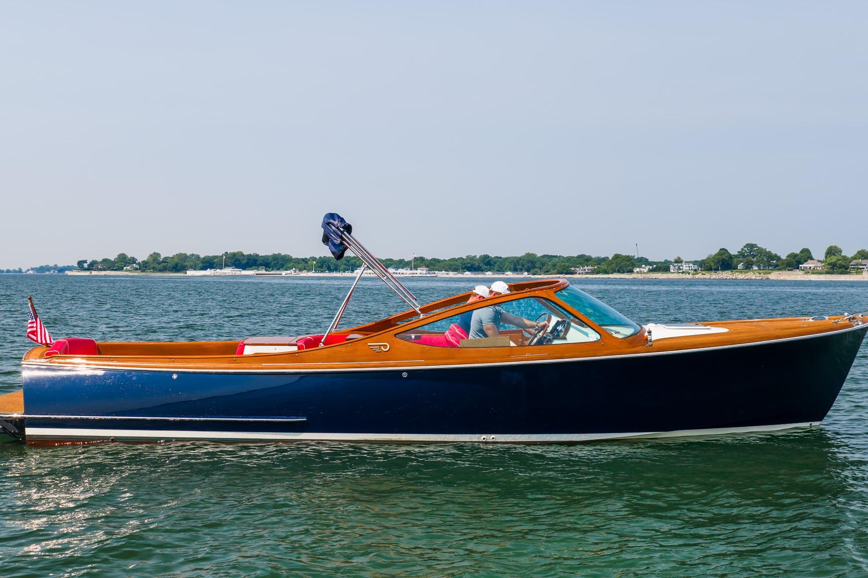 2005 Hinckley Talaria 29R boat cruising on calm waters.