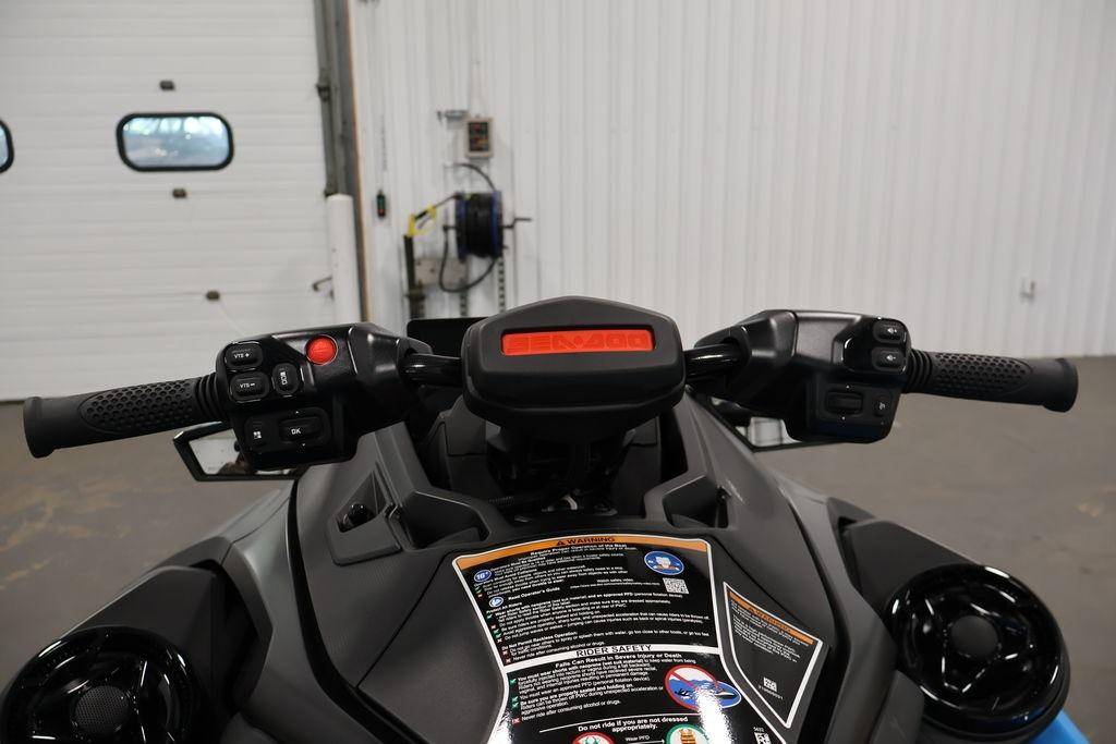 2026 Sea-Doo RXT-X 325 handlebars and dashboard in a garage setting.