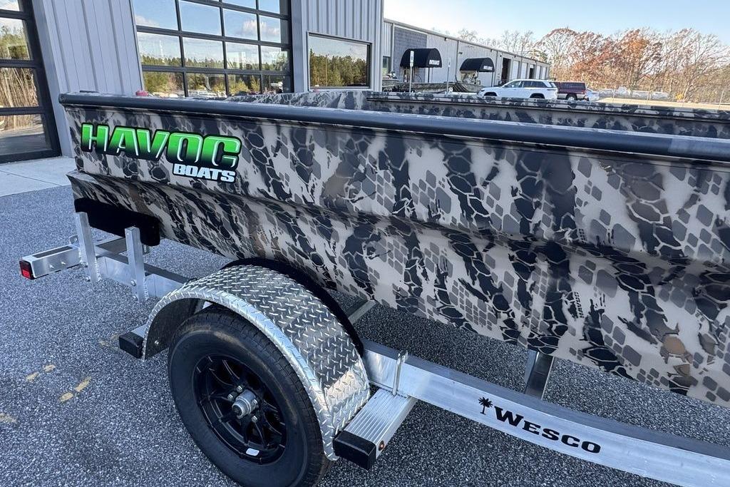 2025 Havoc 1860 boat with camouflage design on a Wesco trailer.