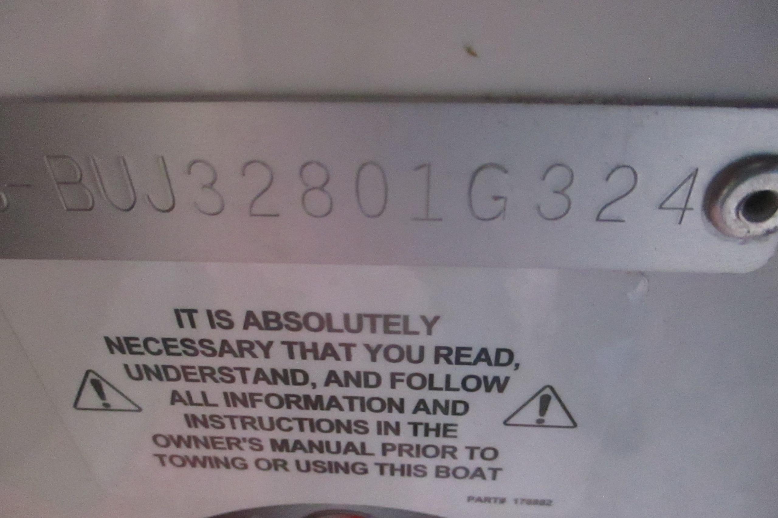 Serial number and safety warning on Tahoe 1950 boat, 2024 model.