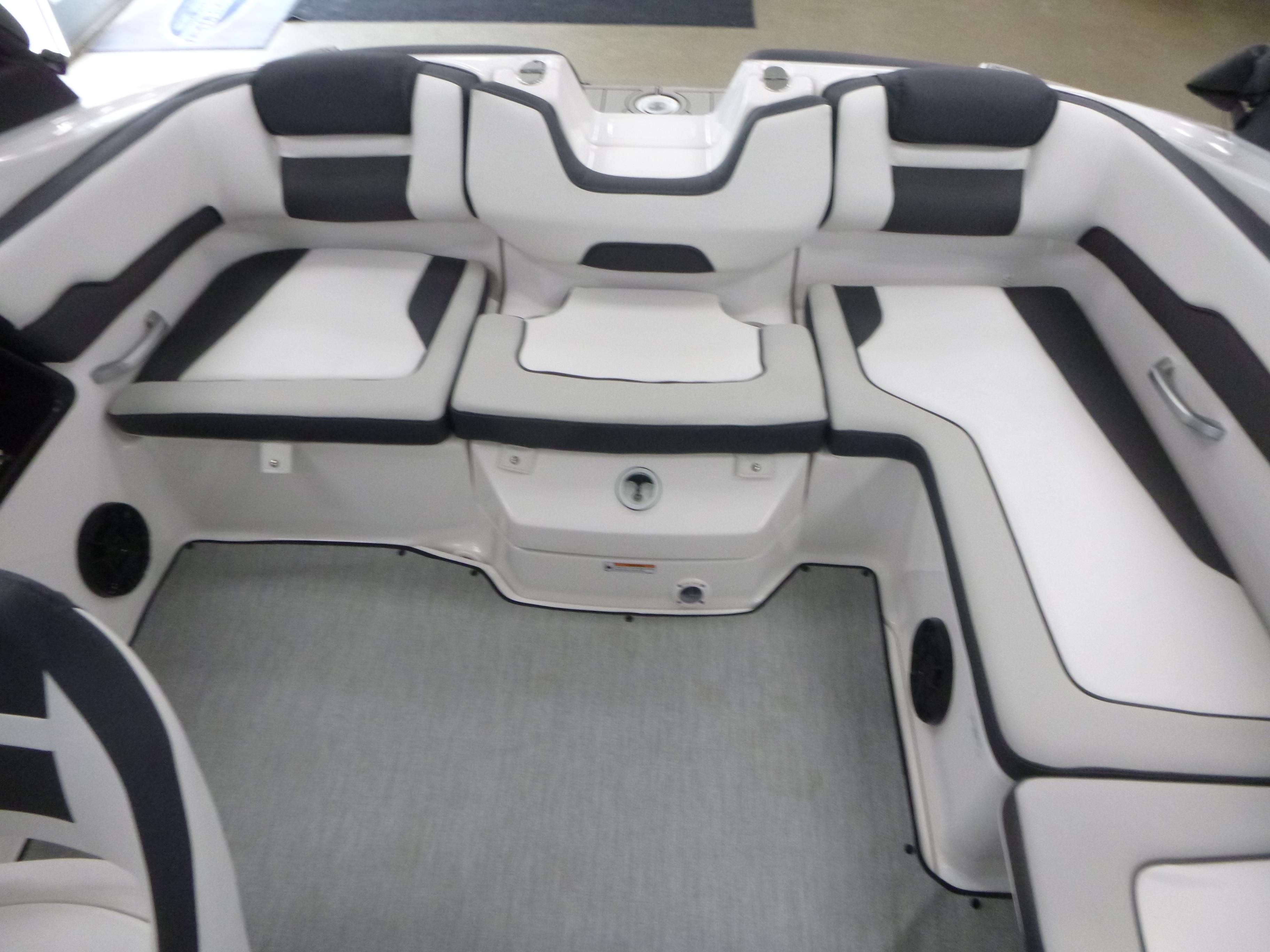 2025 Yamaha Boats AR195 interior seating with sleek white and black upholstery.