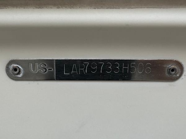 Hull identification number on 2006 Larson LXi 248 boat.