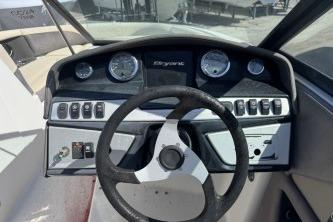 Dashboard of a 2019 Bryant Calandra 23 boat with steering wheel and gauges.