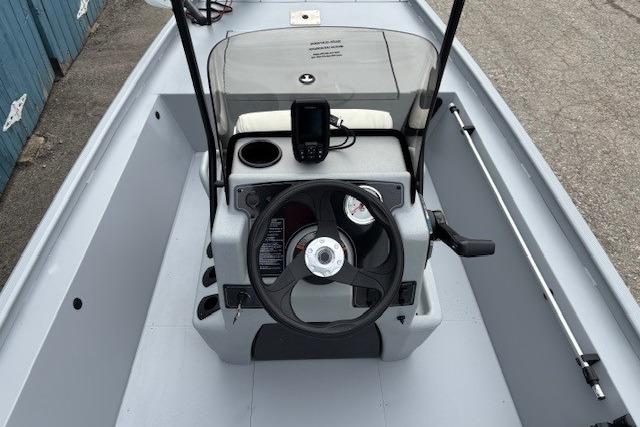 2026 Tracker Bass Tracker Classic CC boat console with steering wheel and navigation equipment.