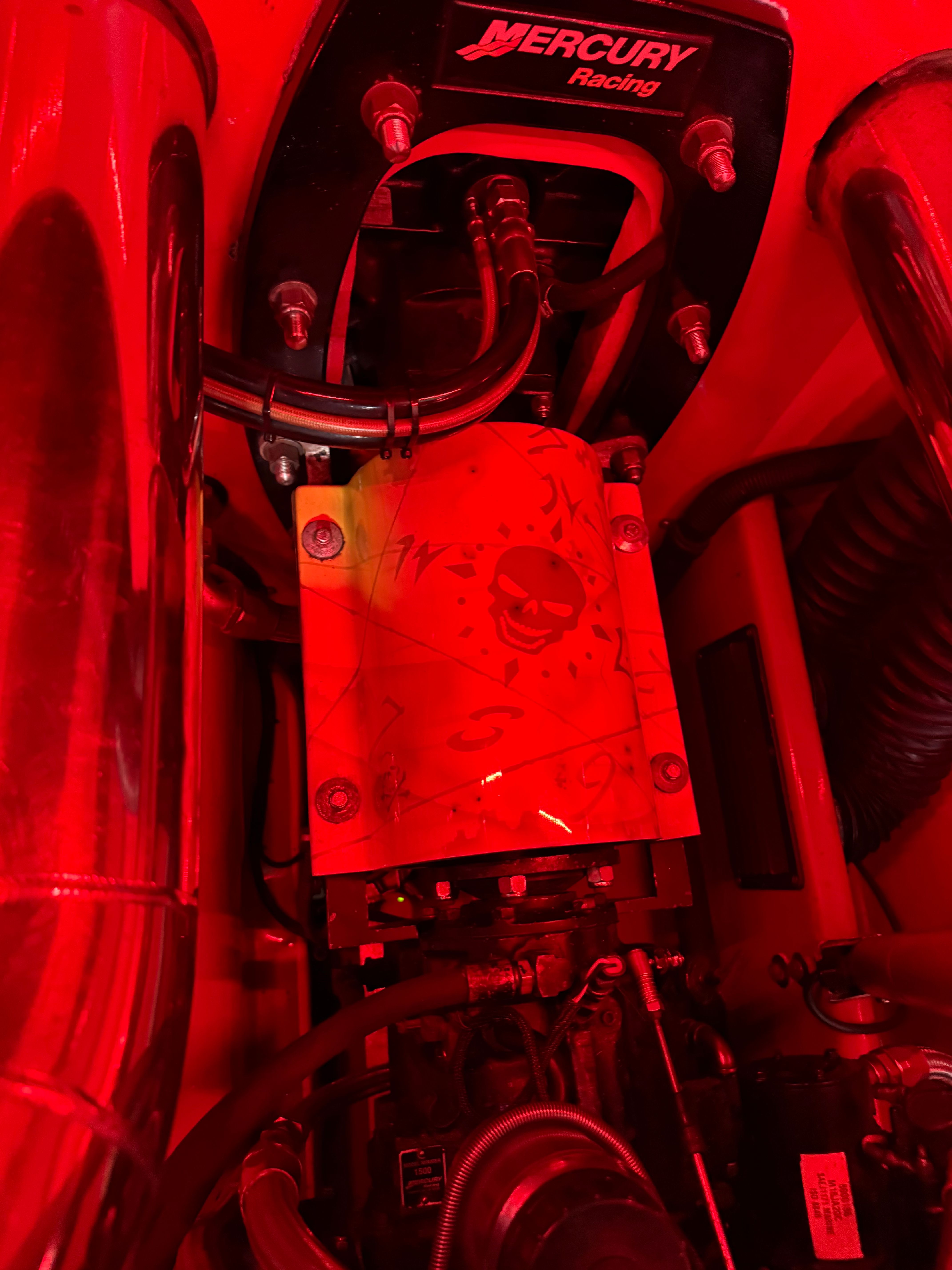 The engine compartment of a 2010 MTI CAT features a Mercury Racing engine with red accents.