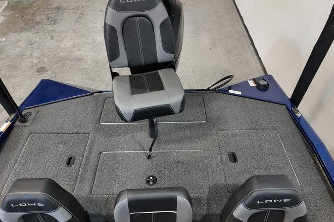 2024 Lowe Stinger 198 boat interior with gray seating and carpeted deck.