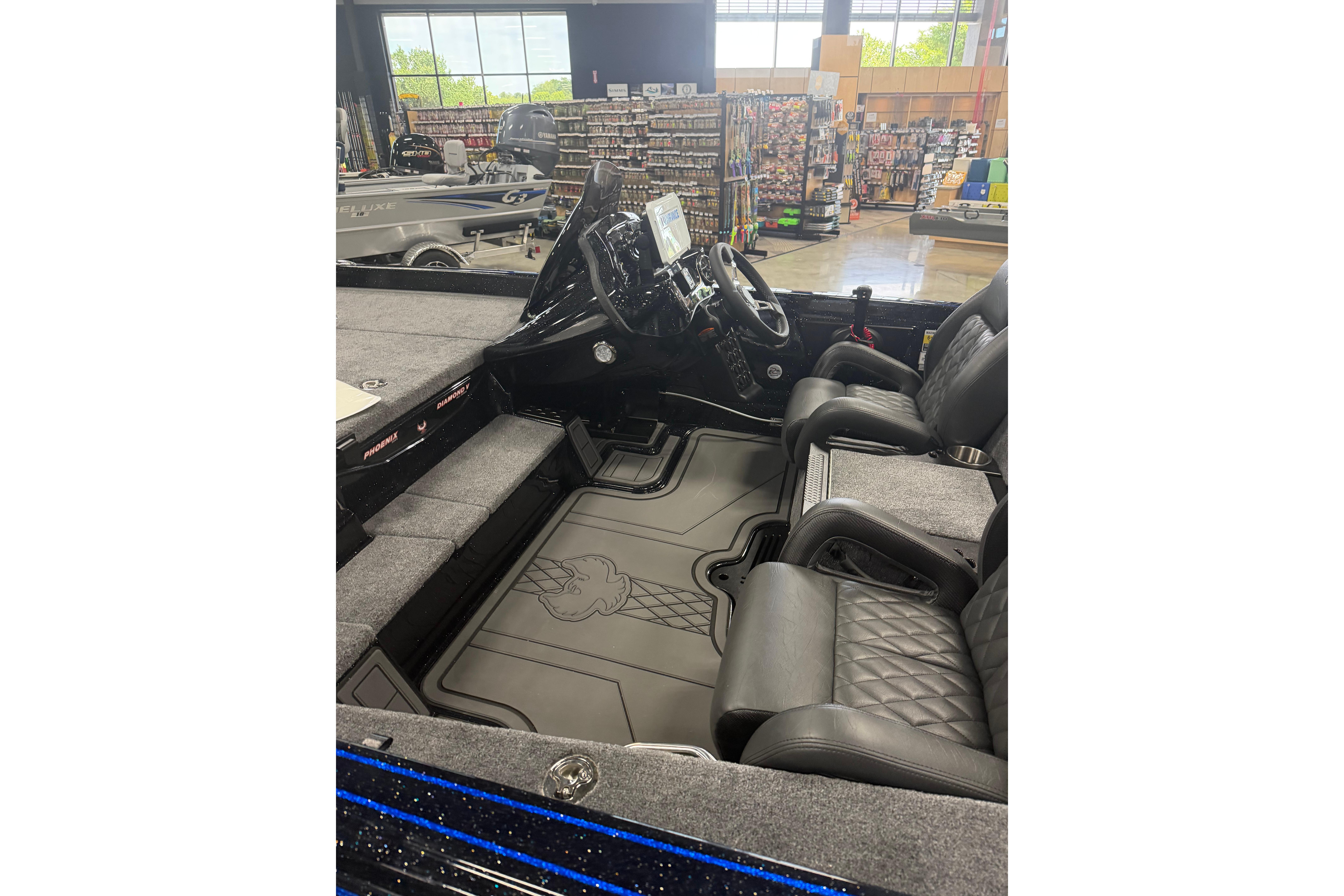 Interior of a 2027 Phoenix 721 ZXL boat with leather seats and modern dashboard.