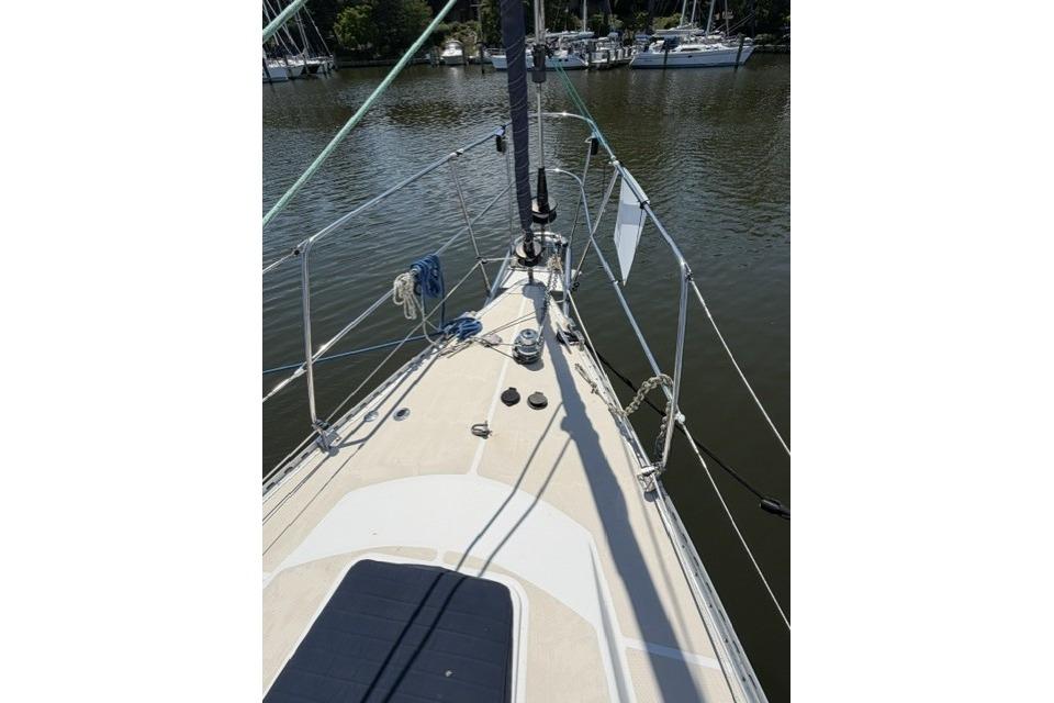Deck view of a 2002 Saga 43 sailboat docked on calm water.