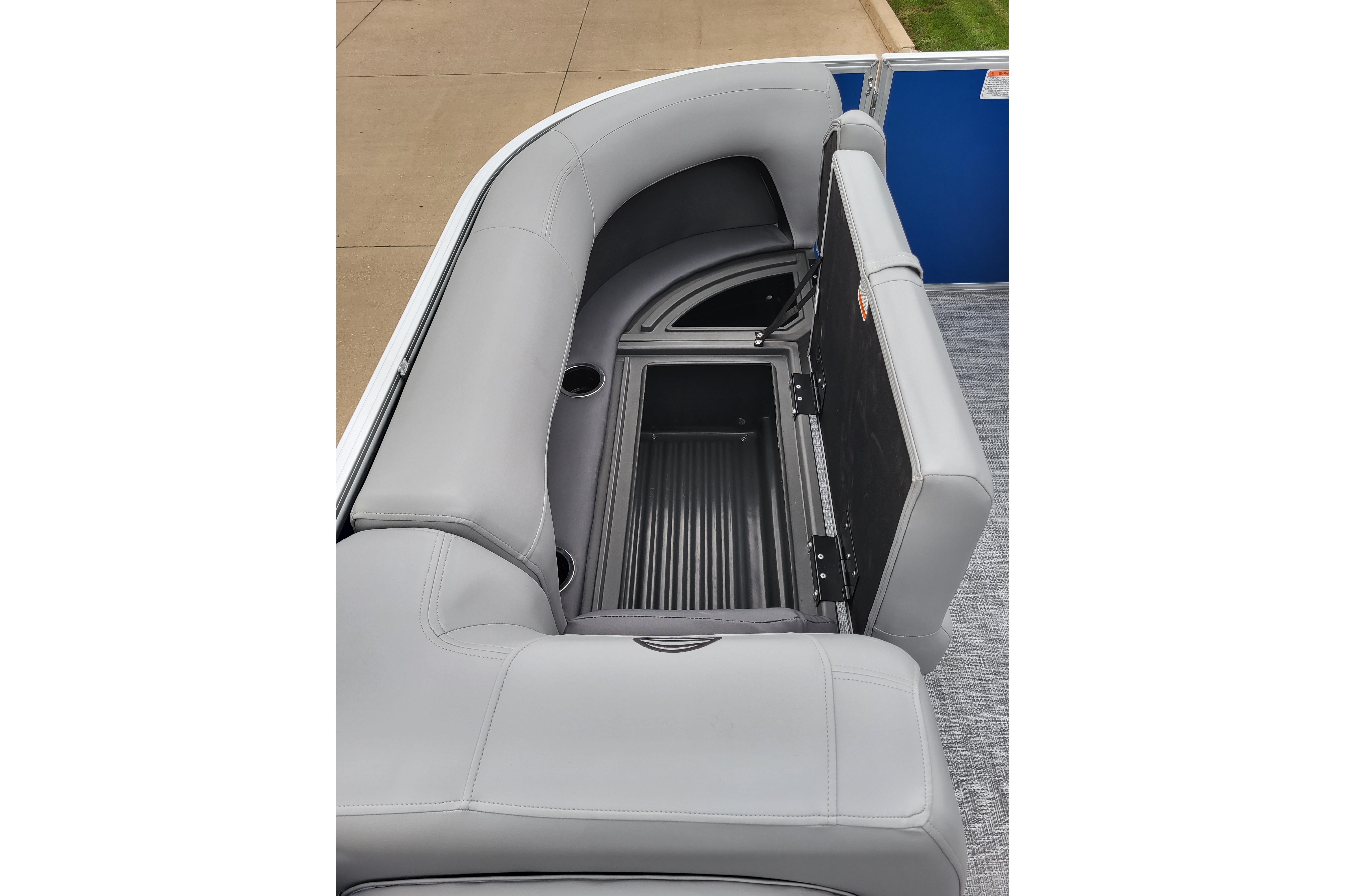 2026 Sun Tracker Party Barge 18 DLX pontoon boat with open storage compartment and gray seating.