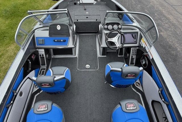 2025 Ranger 1850MS boat interior with blue seats and modern dashboard.