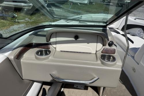 2012 Crownline 215 SS boat interior with cup holders and dashboard.