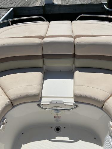 2006 Chaparral 256 SSi boat interior with beige seating and open deck space.