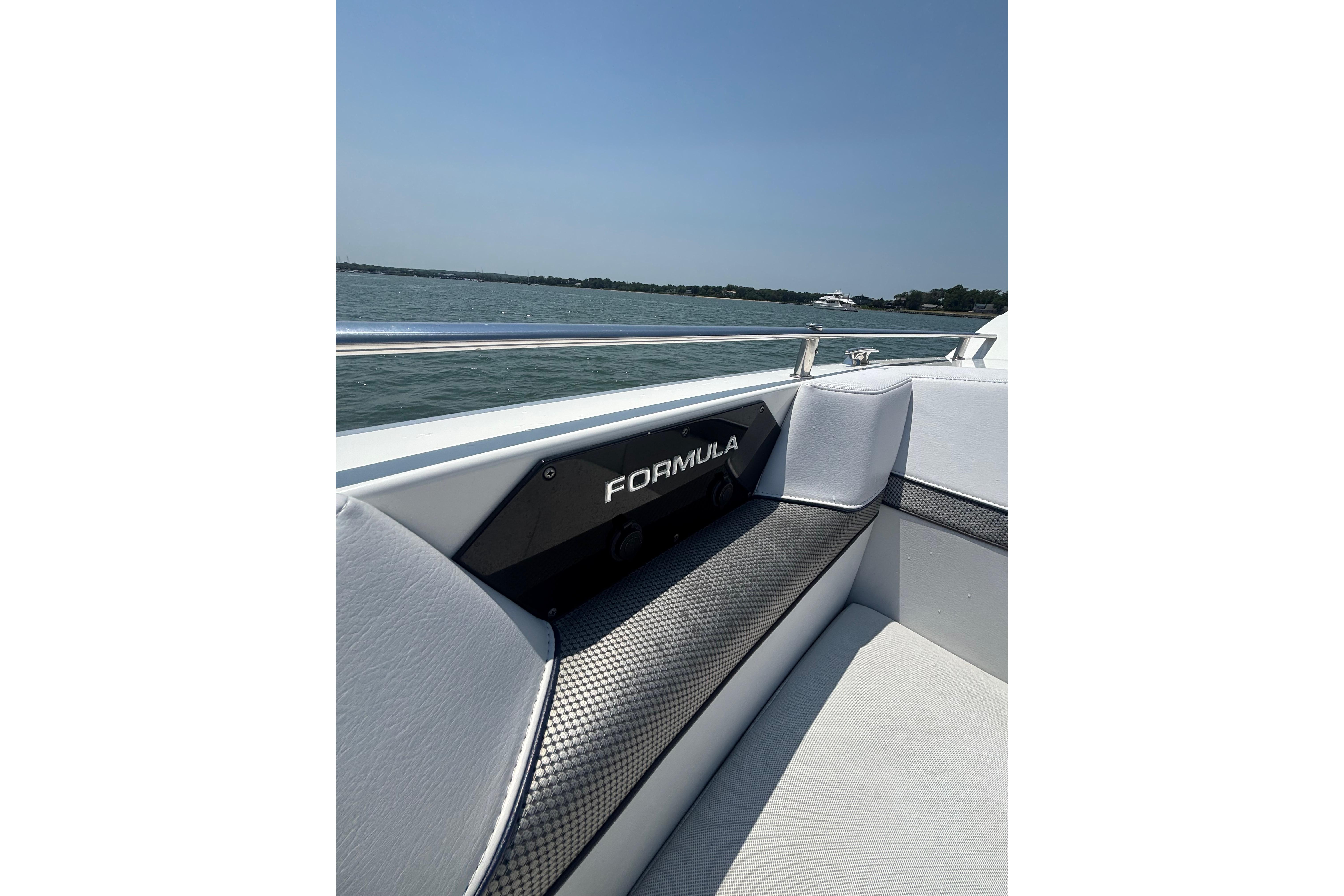 2019 Formula 430 Super Sport Crossover boat interior with sleek seating and water view.