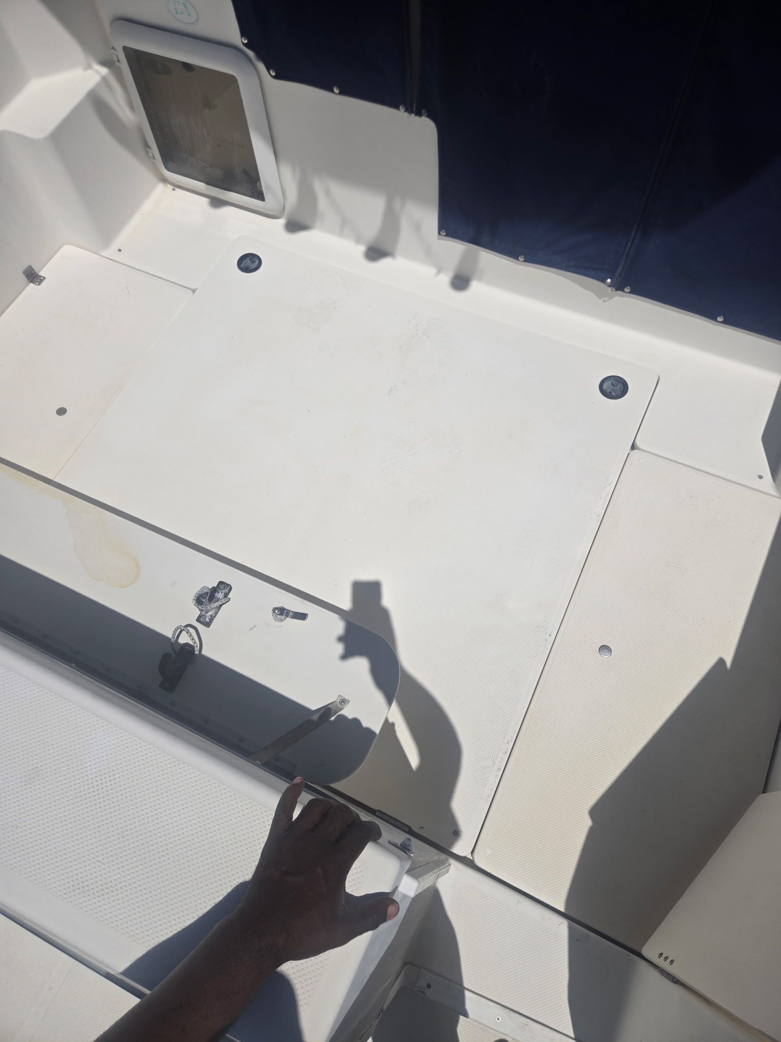 Interior of a 2003 Bayliner 28 boat with white deck.