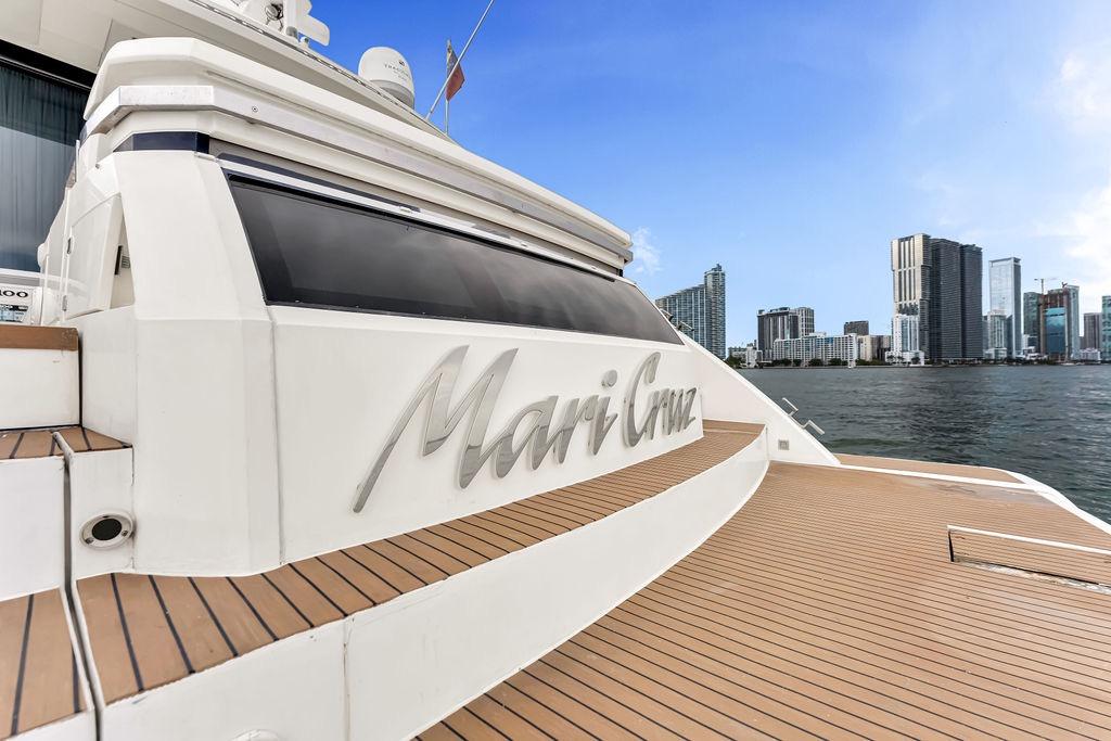 Luxury Fairline Targa 58 yacht, 2012 model, docked with city skyline in background.
