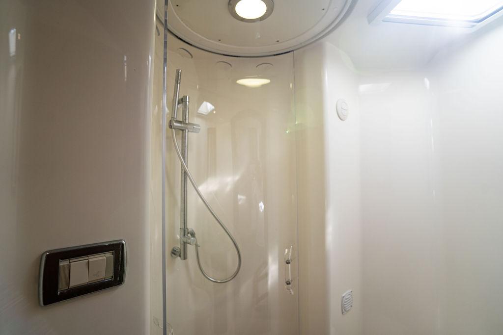 2015 SeaVee 430 Fisharound shower interior with modern fixtures and lighting.