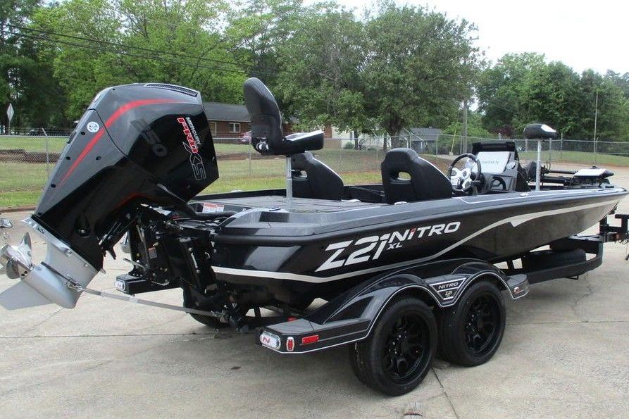 2026 Tracker Pro Guide V-16 WT boat on trailer, featuring powerful outboard motor.