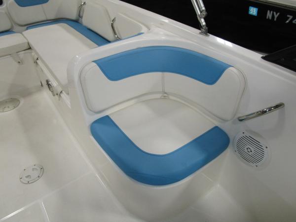 2023 Bayliner 210EL boat interior with blue and white seating.