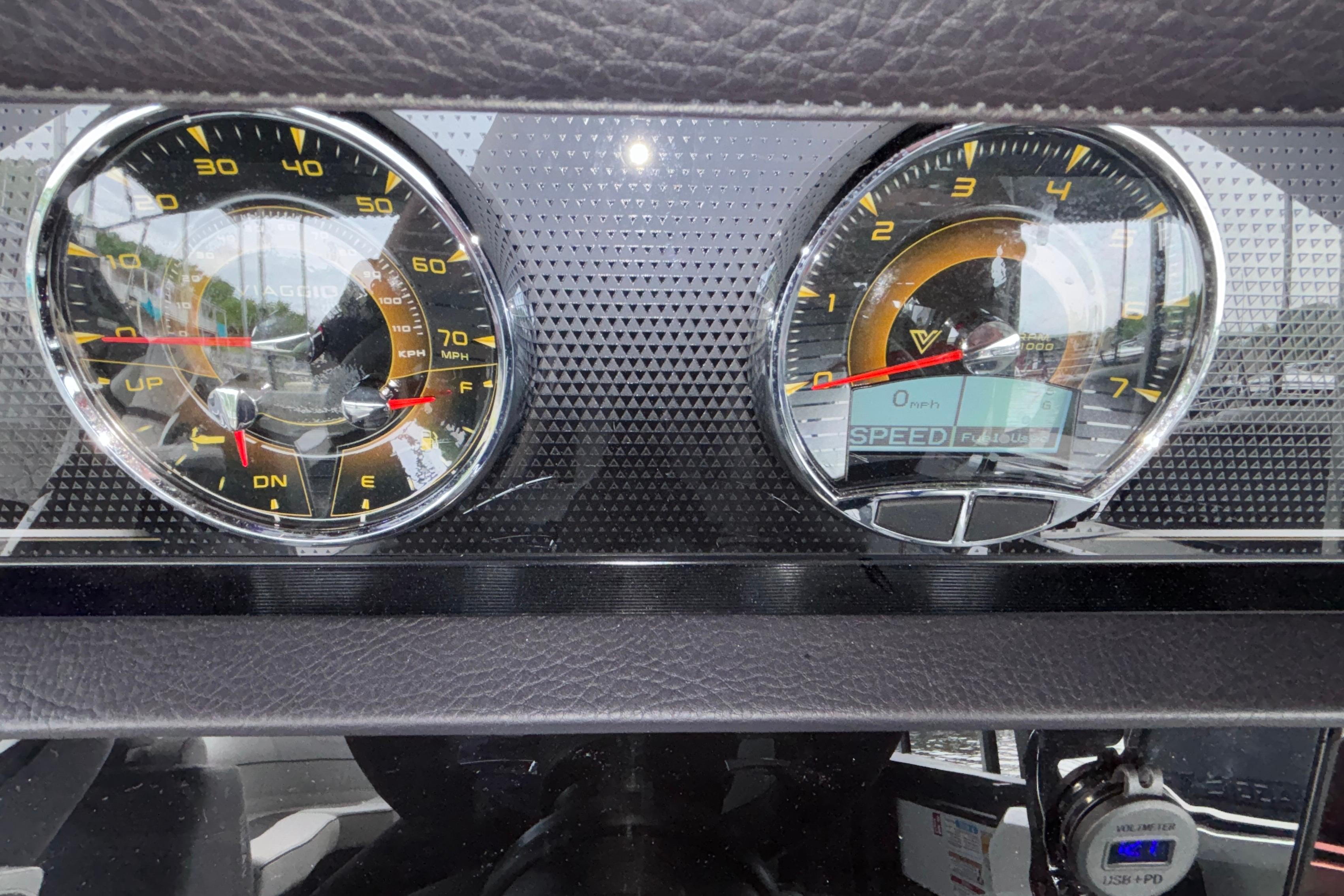 Dashboard of a 2026 Viaggio D26U with speedometer and tachometer gauges.
