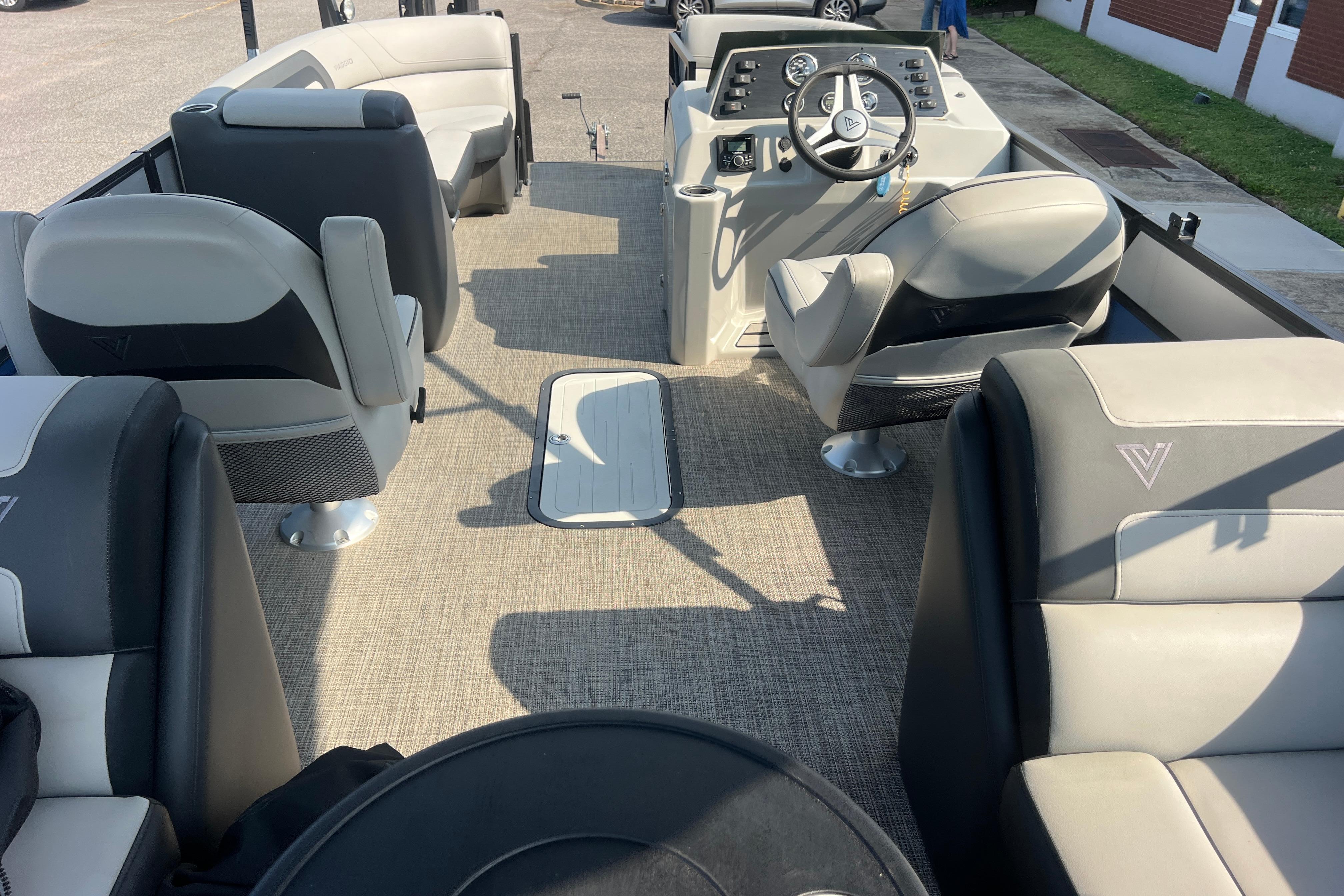 Interior of 2022 Viaggio Lago V-U 22 pontoon boat with modern seating and steering console.