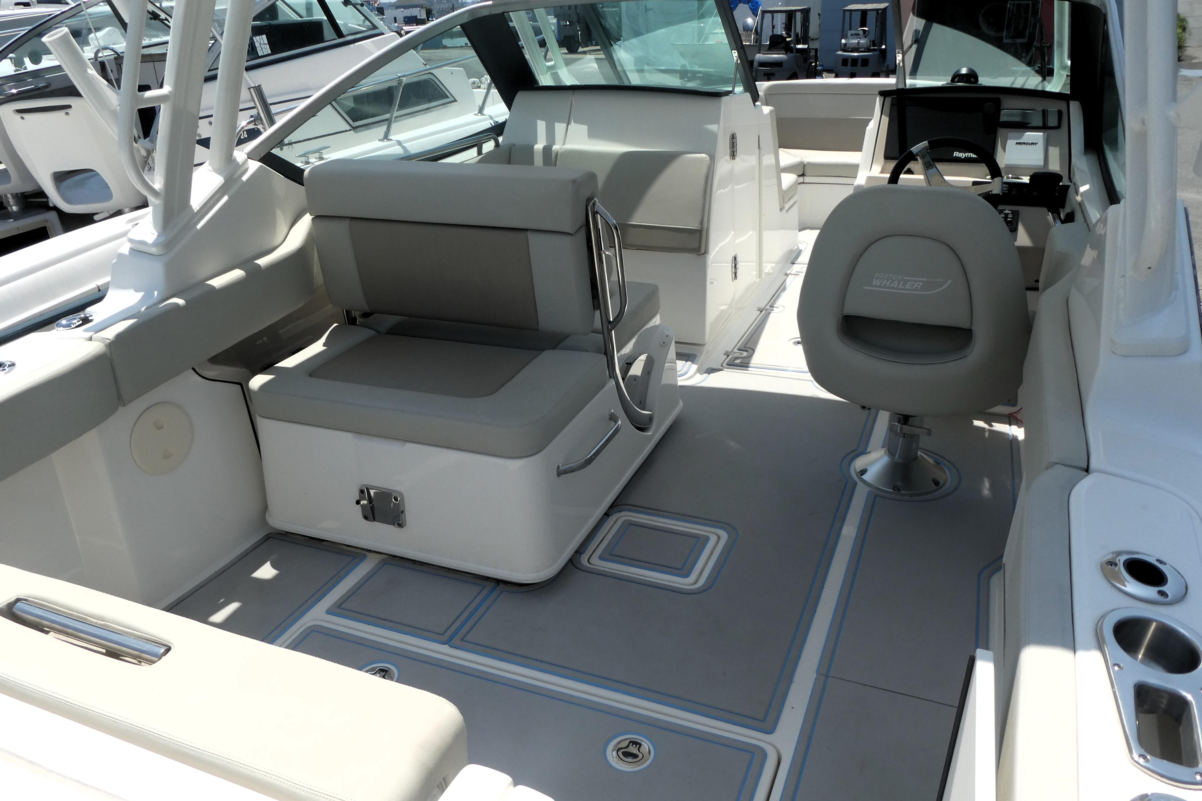2022 Boston Whaler 240 Vantage boat interior with seating and steering console.