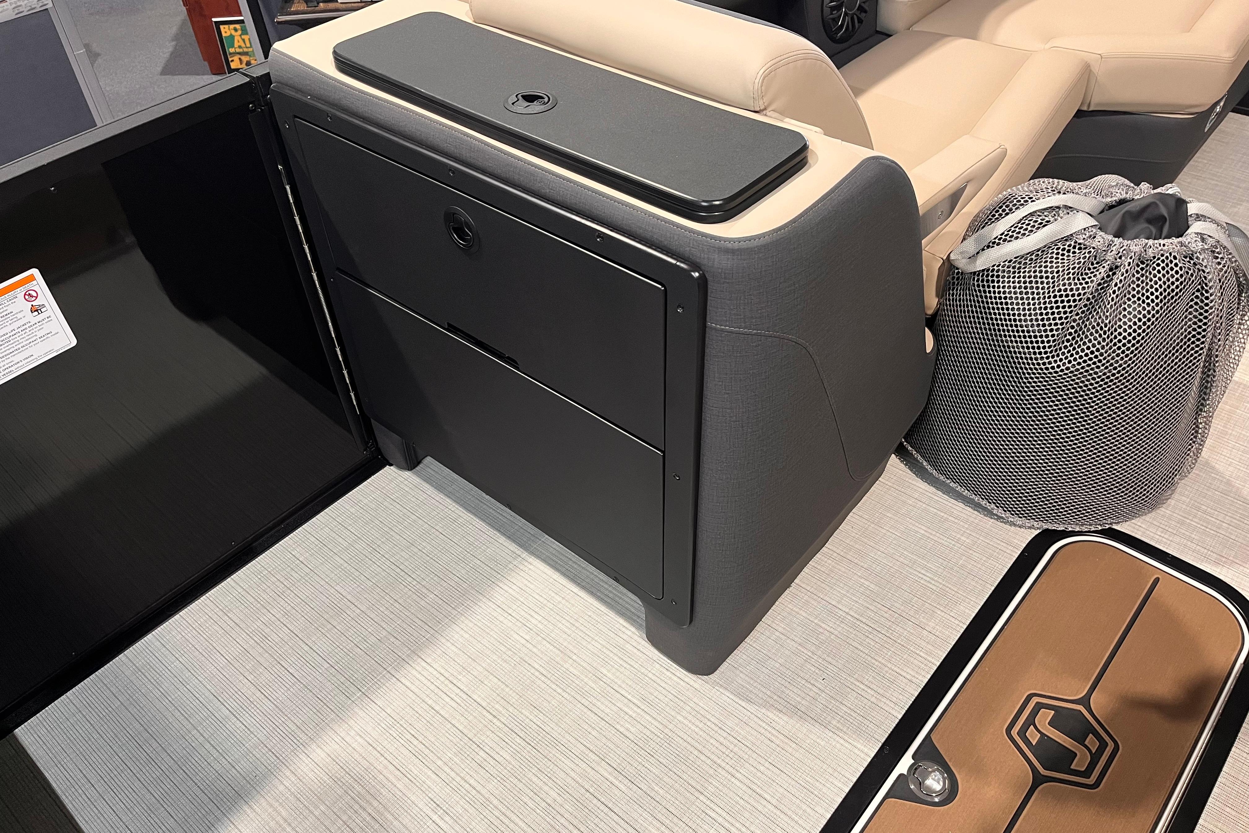 2026 Harris Sunliner 250 interior with seating, storage, and mesh bag on deck.
