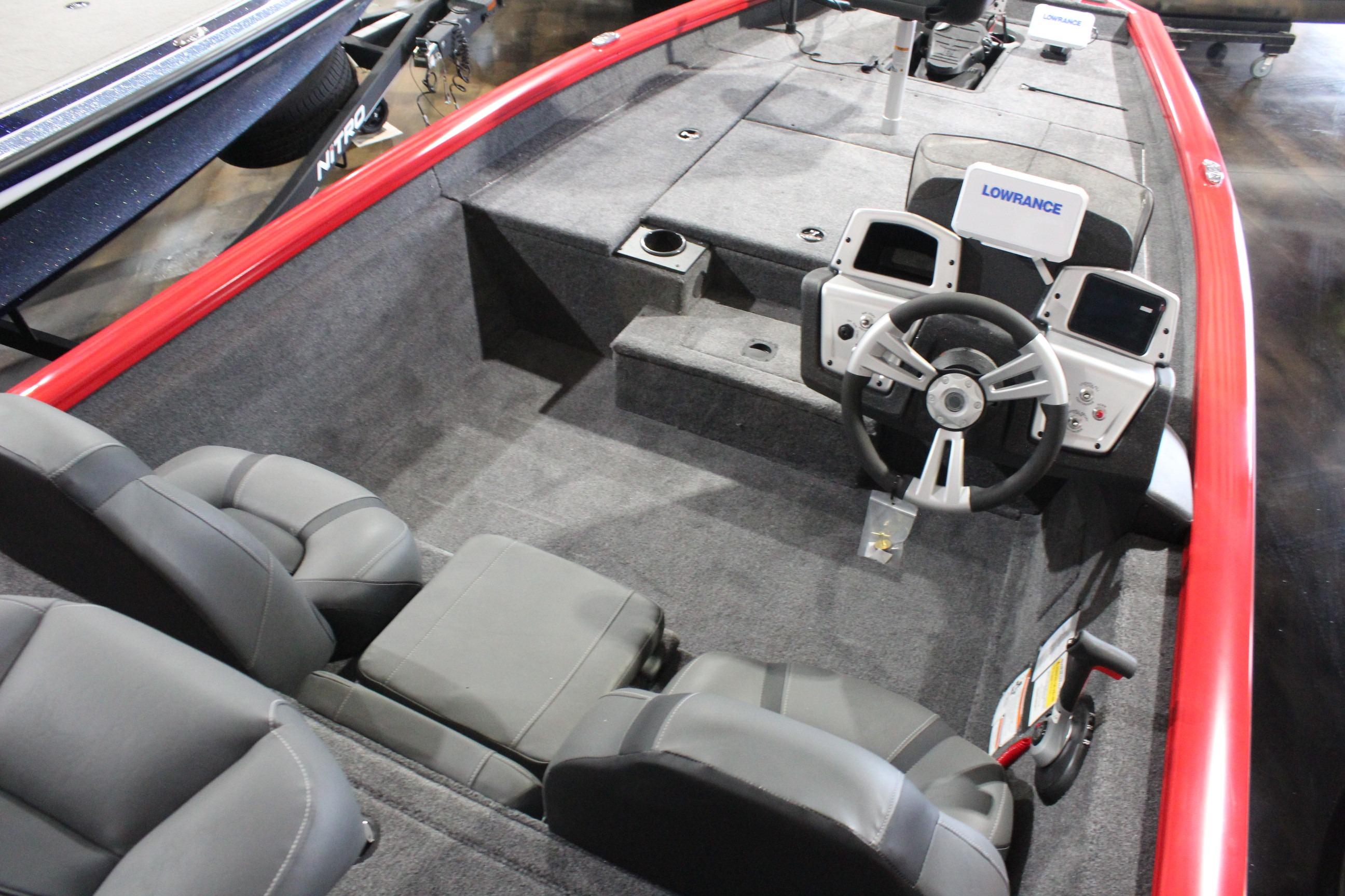2026 Tracker Pro Team 175 boat interior with steering wheel and seating.