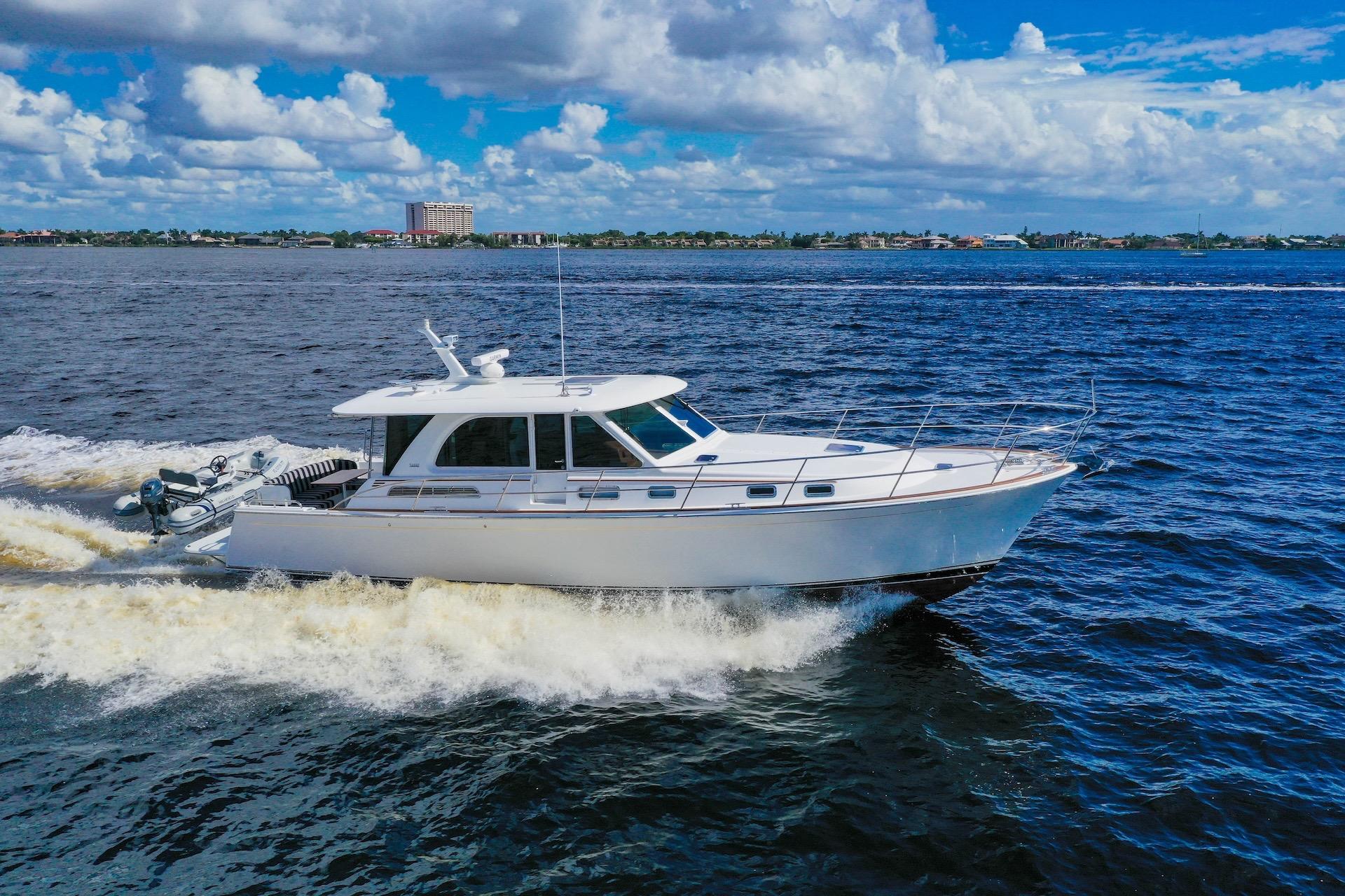 2019 Sabre 45 Salon Express cruising on open water under a blue sky.
