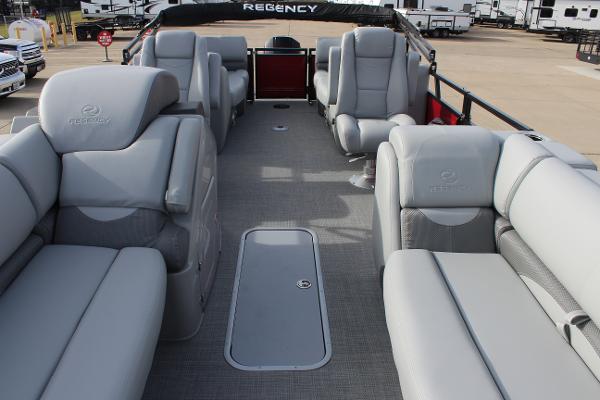 2025 Regency 230 DL3 pontoon boat interior with luxurious gray seating.